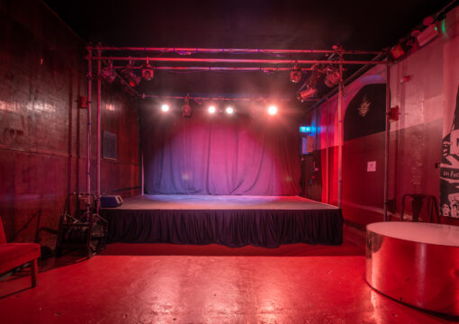 square shaped stage and dance floor in the social club