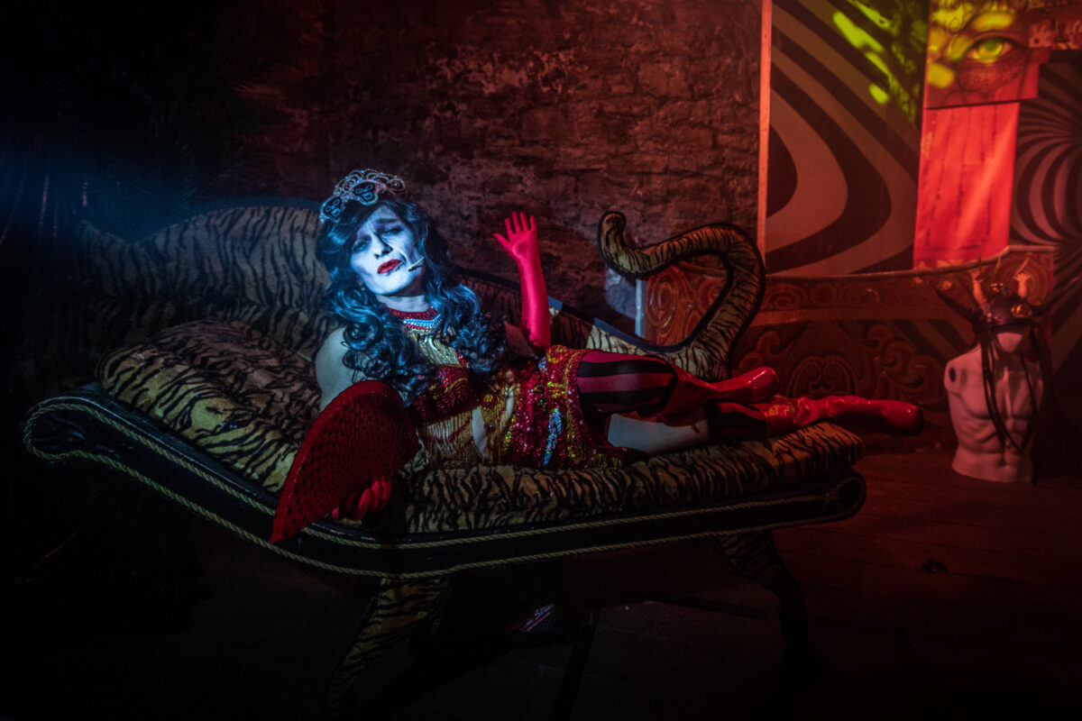A performer led down posing for the camera.