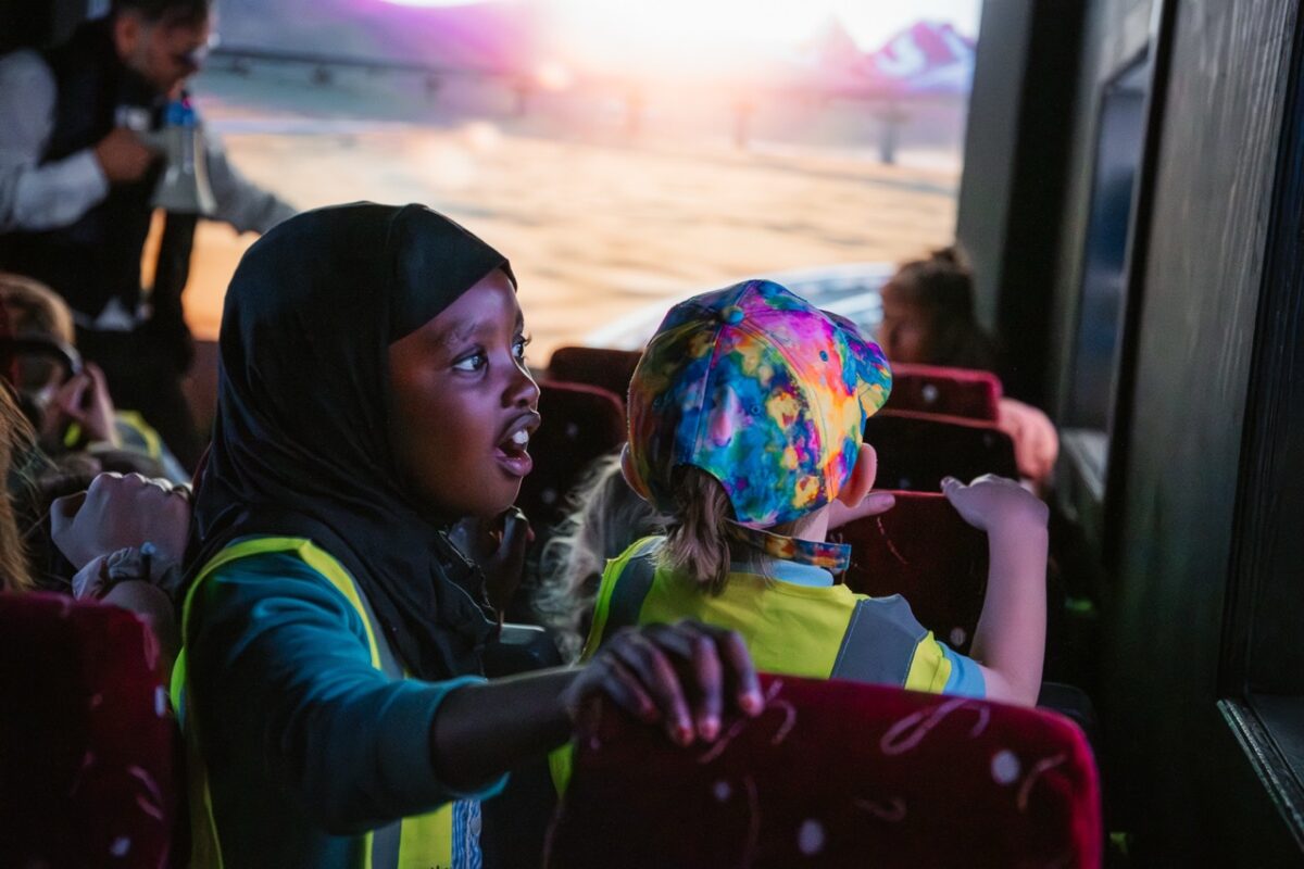 a child looking amazed at something outside the field of view.  